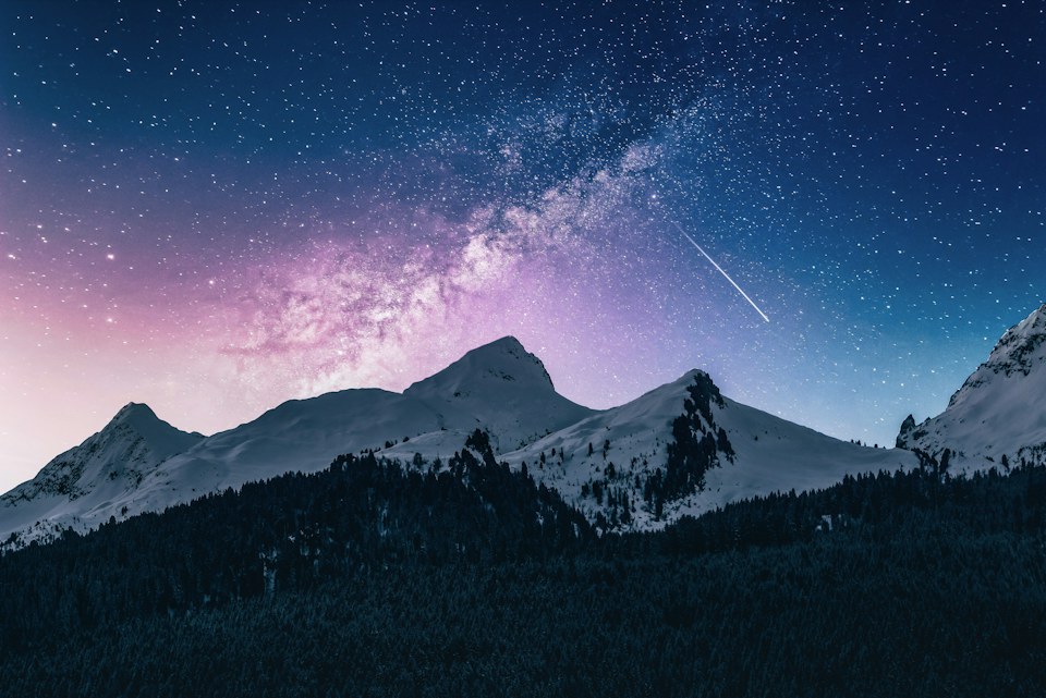 Stars above a snow-covered mountain